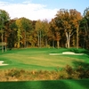 A fall view of green protected by bunkers at Augustine Golf Club