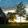 A sunny view of the clubhouse at Renditions Golf Club