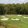 A view of green surrounded by bunkers at Renditions Golf Club