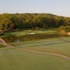 A view over the water of hole protected by bunkers and bridges with bridges on both sides at Renditions Golf Club